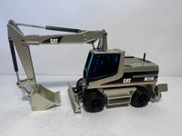 Caterpillar M 318 Mobilbagger mattgold 1:50 von NZG 405